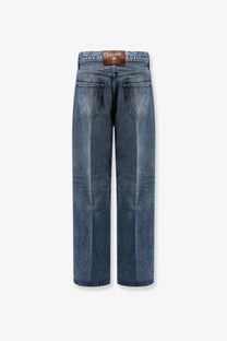 Celine women’s high-waisted wide-leg denim jeans in medium blue wash showing classic stitching and back pockets from the back side