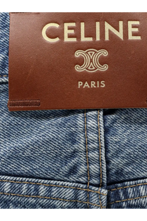 Celine women’s blue denim jeans made of denim with a brown leather brand tag visible on the back side