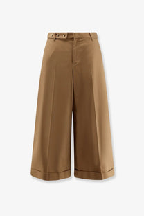 Celine women’s dock cotton beige trousers with wide-leg cropped fit buttoned belt loops and rolled cuffs