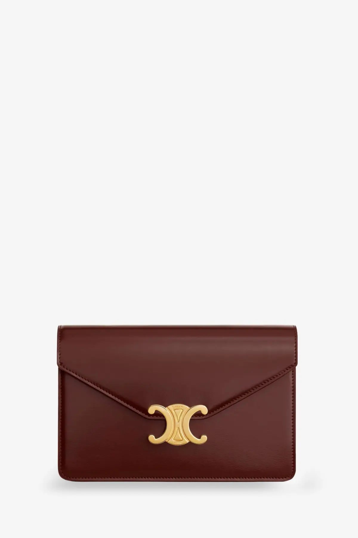 Celine women’s margo leather crossbody bag in brown featuring a sleek burgundy leather clutch with gold c-shaped clasp