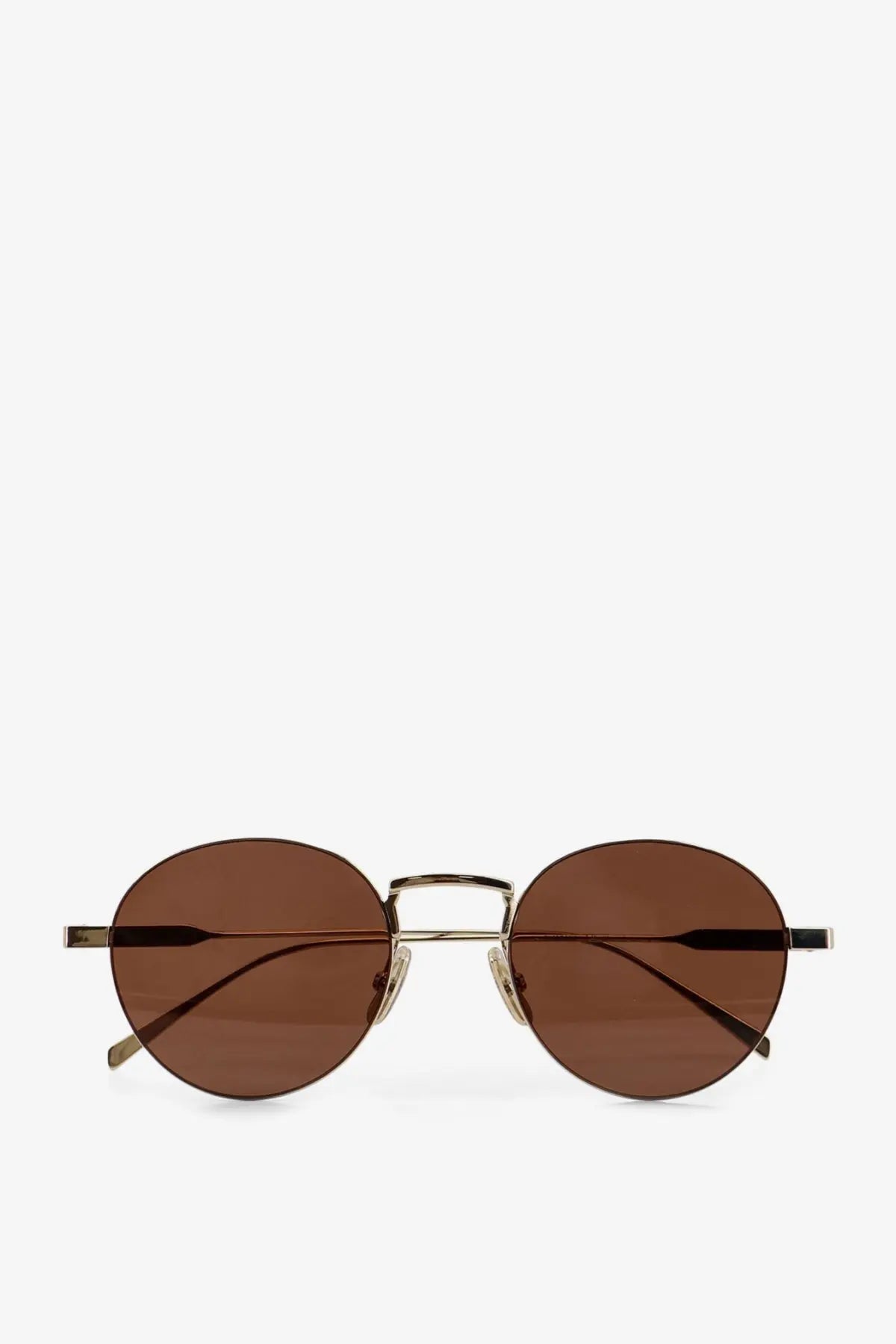 Celine women’s metal sunglasses with round brown-tinted lenses and gold-toned frame with black temple tips