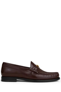 Celine women’s brown leather moccasin loafer with gold-tone metal buckle for stylish casual wear