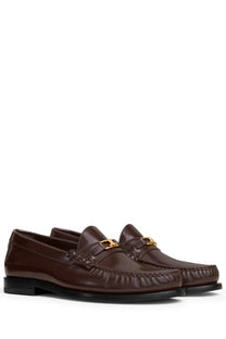 Celine women’s moccasin brown leather loafers with gold tone metal buckle for stylish casual wear