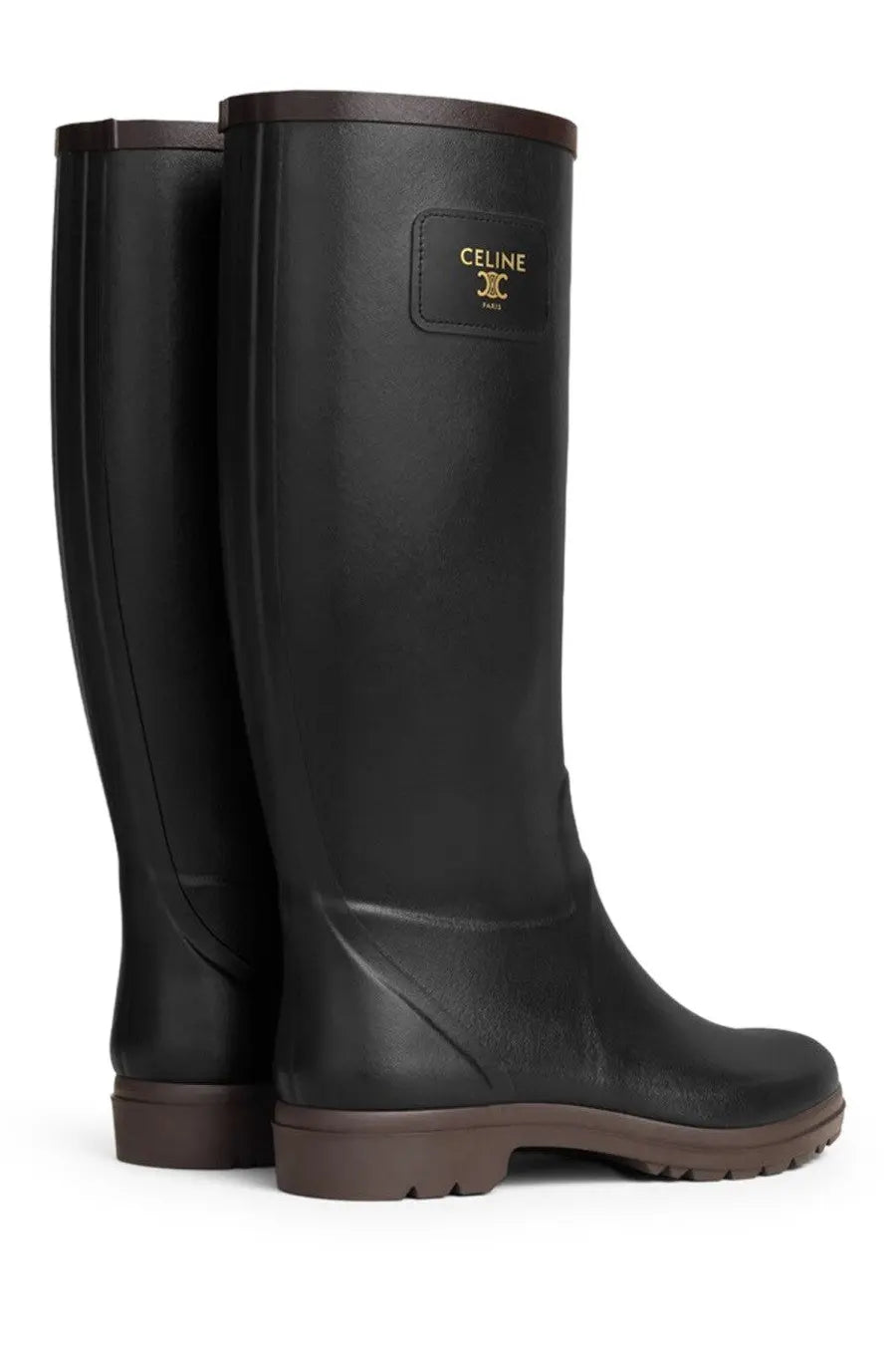 Black celine women’s rainboot made of rubber with brown soles and trim for rainy weather use