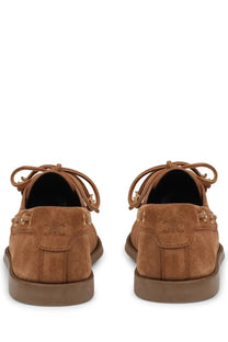 Tan suede celine women’s bateau beige boat shoes with gold-tone eyelets and embossed logo on the heel back side