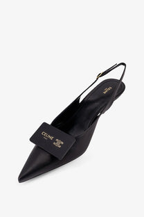 Black celine women’s signature leather pointed-toe slingback pump with gold-tone logo plaque on the toe