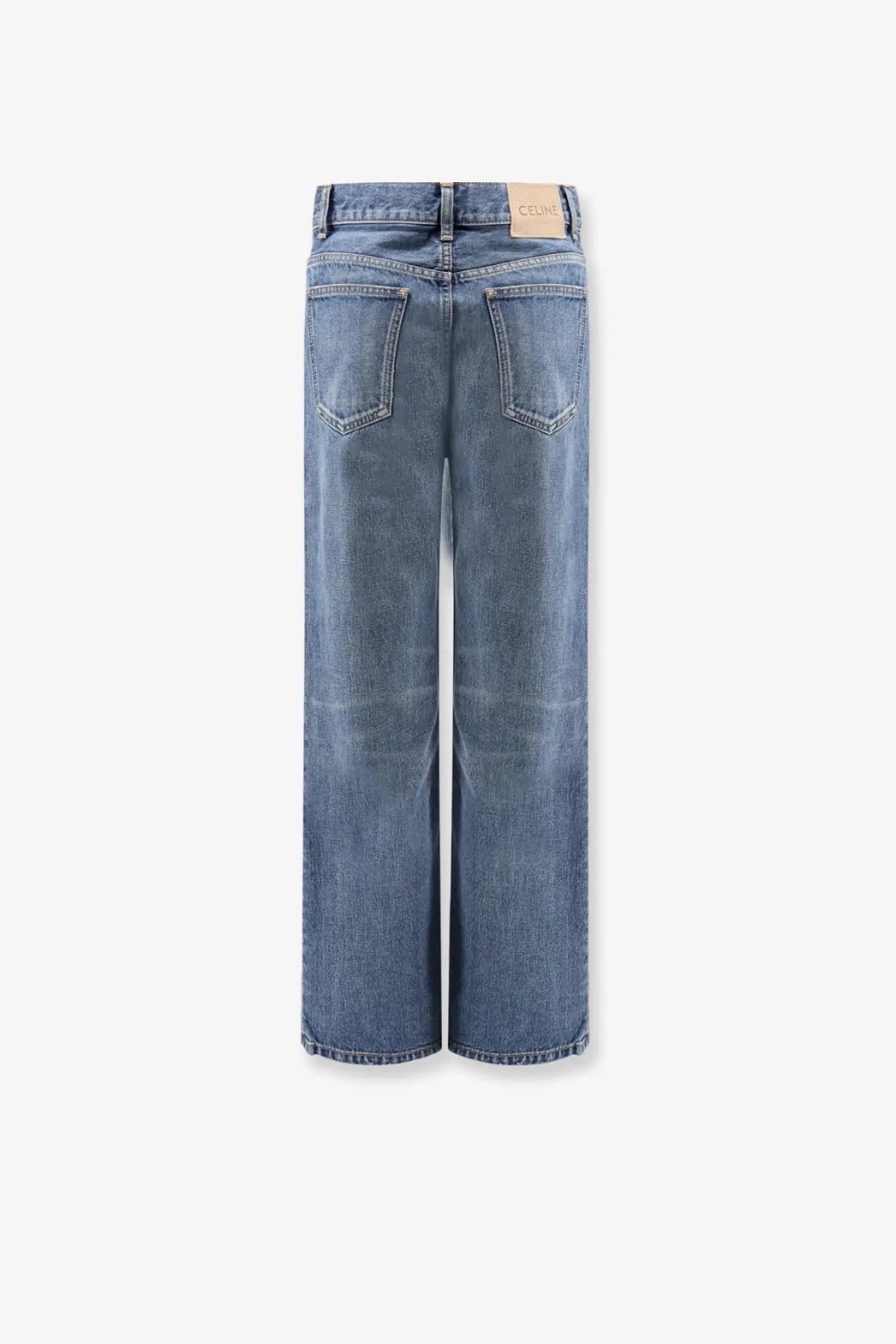 Back side of Celine women’s stone washed cotton wide-leg denim jeans in medium-wash blue with classic stitching and pockets
