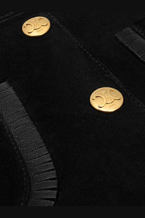 Celine women’s black suede miniskirt with black suede clutch featuring gold-tone circular hardware and logo