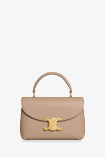 Beige leather celine handbag with gold-tone cc clasp and top handle featured in celine women’s teen nino crossbody bag green