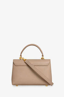 Beige leather handbag with gold-tone hardware and detachable shoulder strap from celine women’s teen nino crossbody bag green