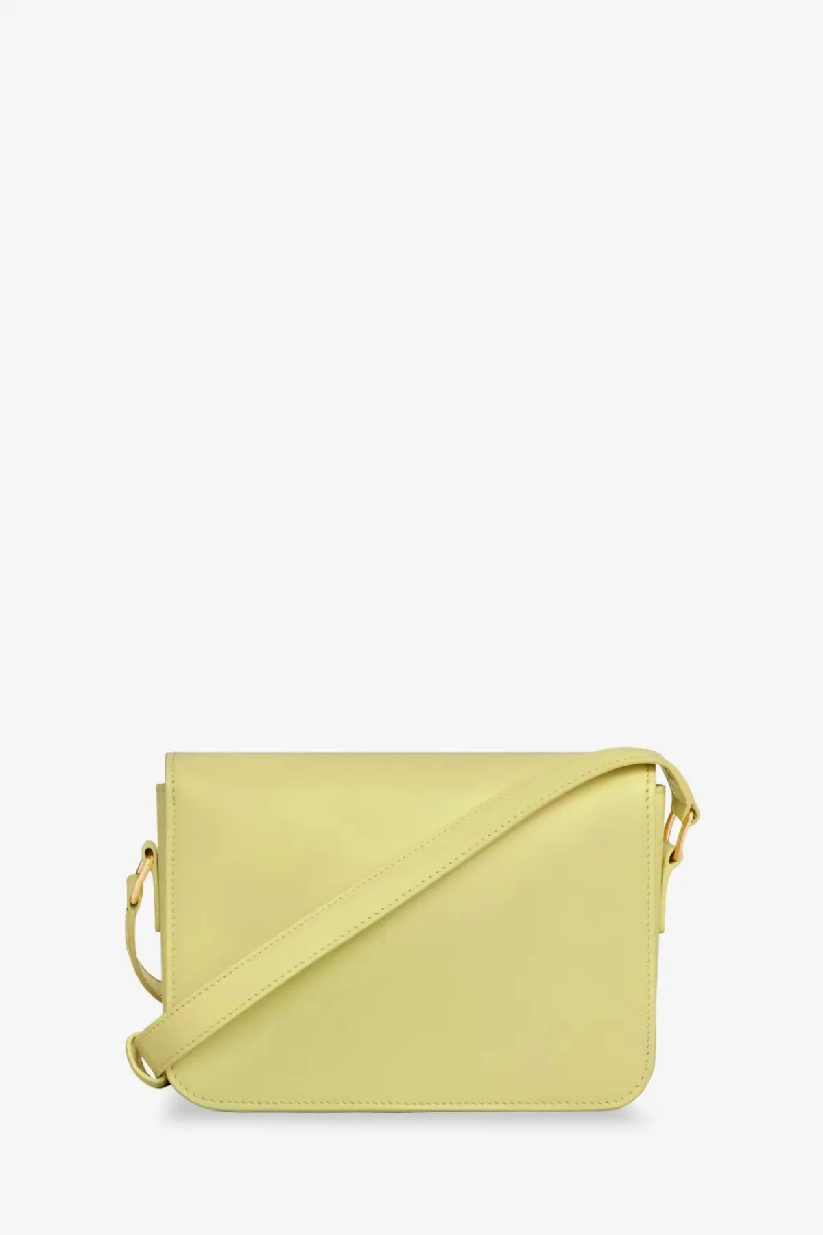 Celine women’s teen triomphe leather crossbody bag in pale yellow with smooth minimalist design and adjustable strap