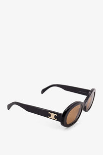 Celine women’s triomphe black acetate sunglasses with black oval frames gold-tone logo and brown lenses