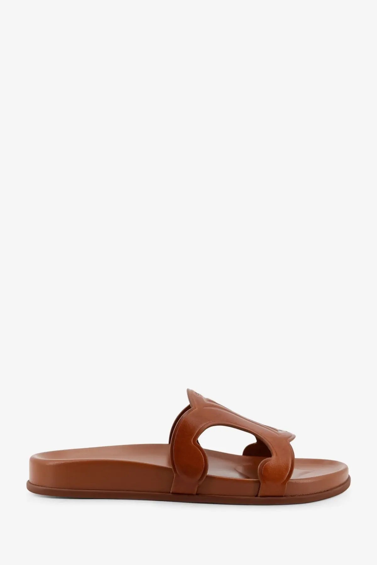 Brown leather slide sandal with minimalist sculpted strap design from Celine women’s Triomphe leather sandals beige collection
