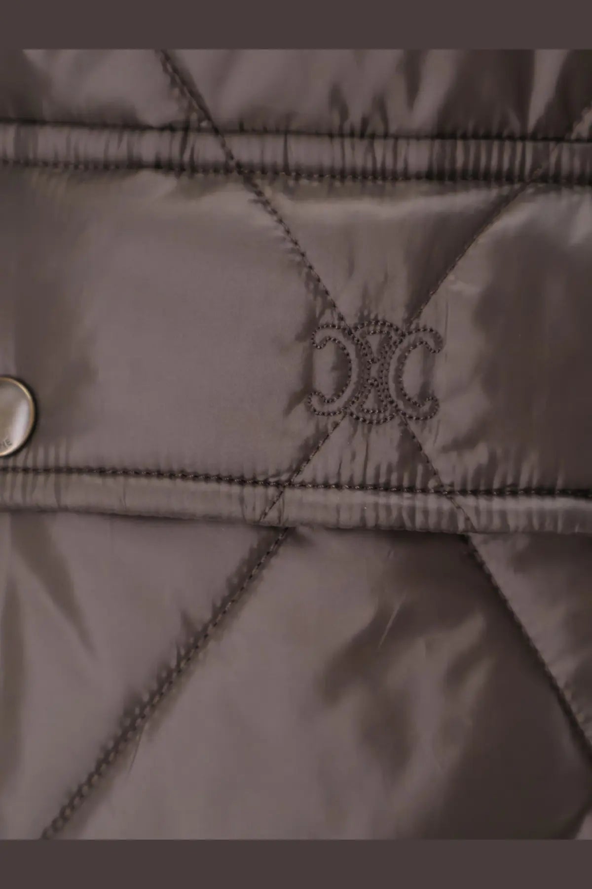 Celine women’s green quilted jacket with subtle embroidered logo at the center front in lightweight fabric