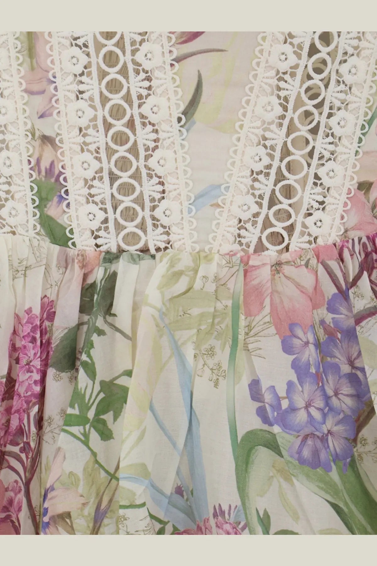 Charo Ruiz Ibiza women’s white gardenia mini dress with delicate white lace trim and colorful botanical print