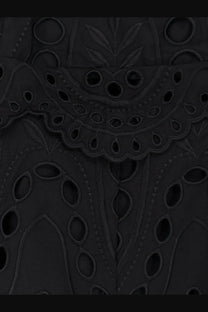 Black embroidered lace with intricate circular and leaf patterns on charo ruiz ibiza women’s glimmer long dress