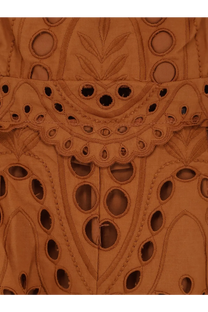 Tan eyelet lace fabric with intricate floral and geometric cut-out patterns on charo ruiz ibiza women’s glimmer long dress brown