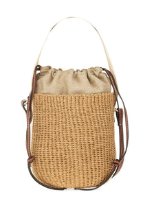 Beige woven straw bucket bag with brown leather straps and drawstring top by chloé women’s borsa secchiello woody white