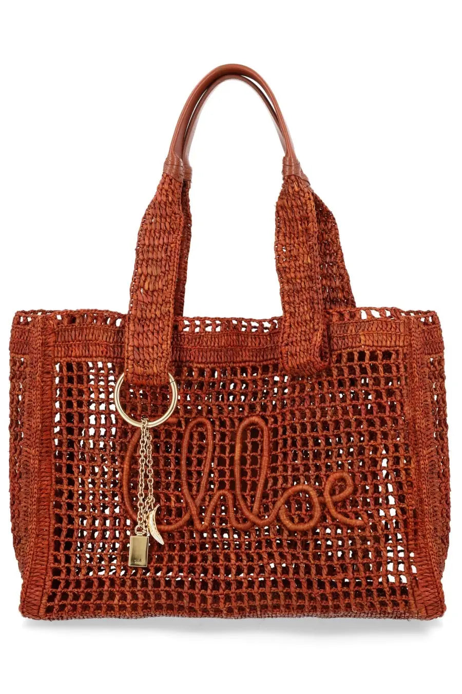 A woven rust-colored chloé womens borsa tote bag with braided handles and gold-tone keychain charm