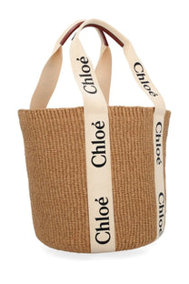 Beige woven straw tote bag with cream handles and black chloé branding in Chloé women’s borsa woody large white