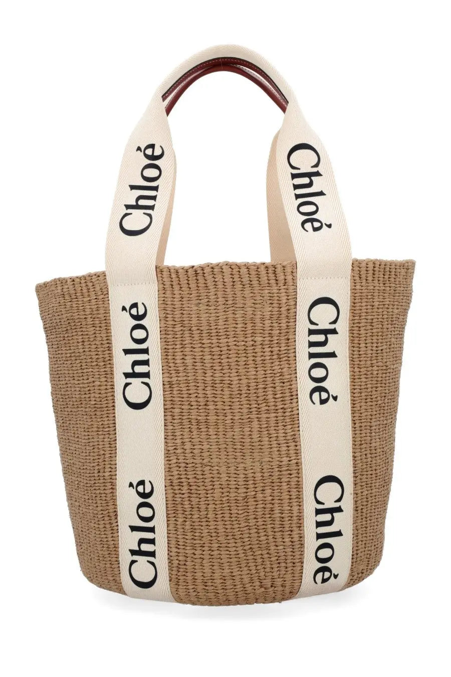 Beige woven straw tote bag with cream handles black chloé lettering and dark brown leather accents from Chloé Woody Large White