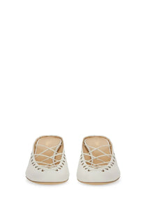 Chloé women’s Écolleté ghillies white leather mules with crisscross lacing and perforated detailing