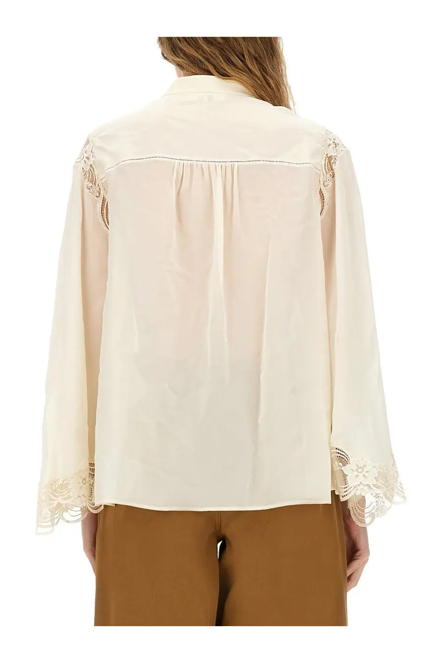 Chloé women’s cream-colored fluid silk georgette blouse with delicate lace trim along shoulders and cuffs