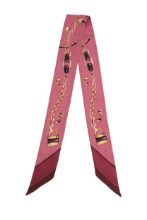 Chloé women’s pink silk foulard featuring gold chains black buckles and lock motifs in a repeating pattern