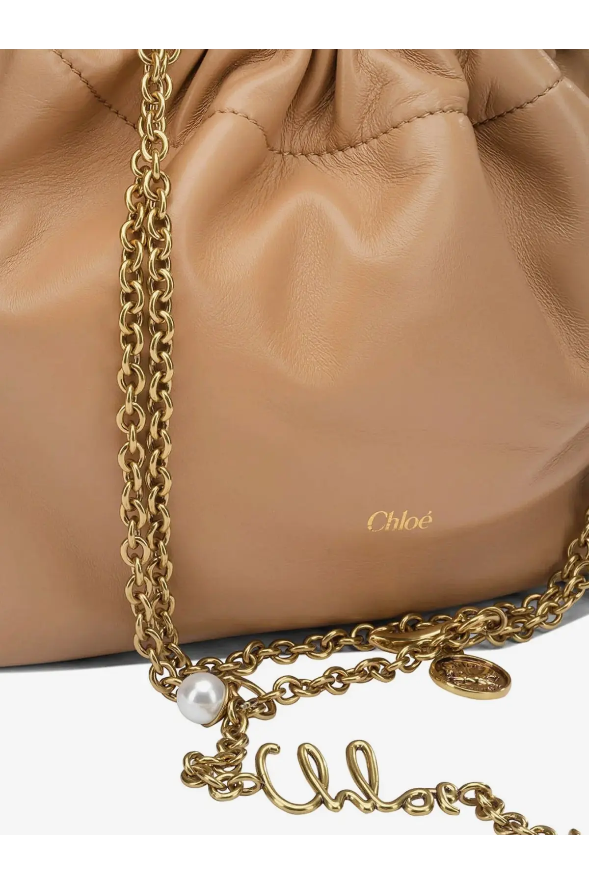 Beige leather Chloé women’s crossbody bag with drawstring closure gold-tone chain strap and black-stitched handles