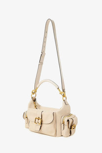 Cream-colored leather Chloé women’s medium double carry crossbody bag with gold-tone hardware and multiple pockets