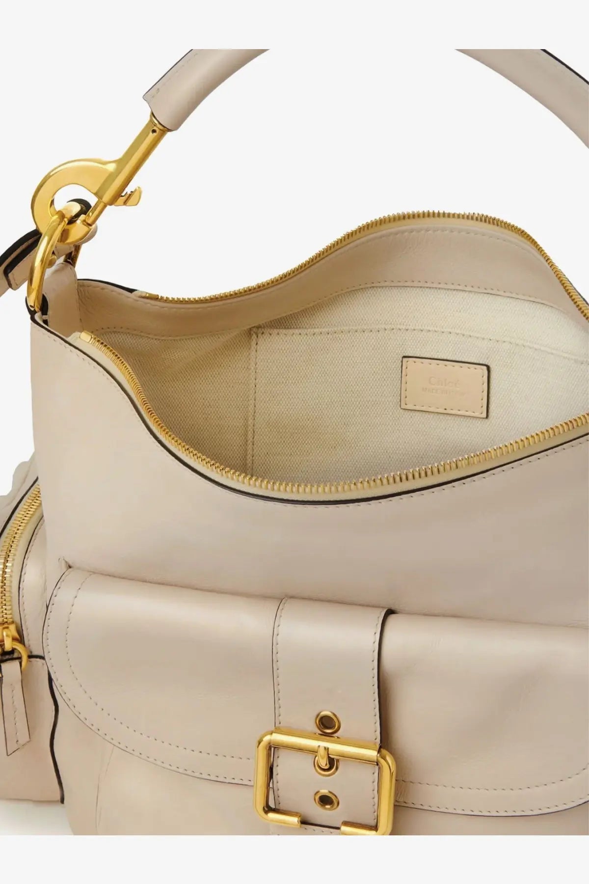 Chloé women’s medium double carry leather shoulder bag in cream-colored leather with gold-tone hardware and front buckle closure