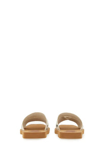 Beige leather slide sandals with tan rubber sole and white metallic accents from chloé women’s sandal woody white collection