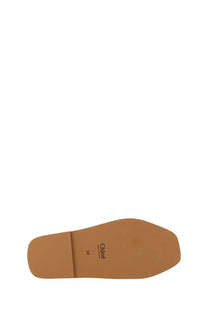Tan leather sole of chloé womens sandal woody white with chloé branding and size 38 printed in black