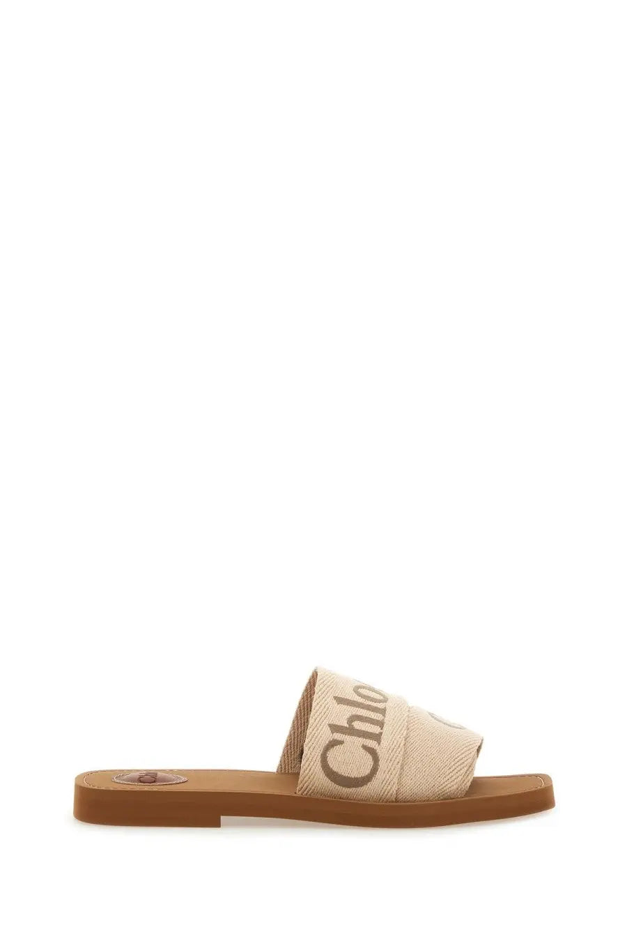 Beige canvas chloé women’s sandalo slide woody white sandal with brown leather sole and dark gray logo lettering