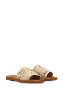 Beige canvas chloé women’s sandalo slide woody white sandals with woven straps and dark brown brand name print