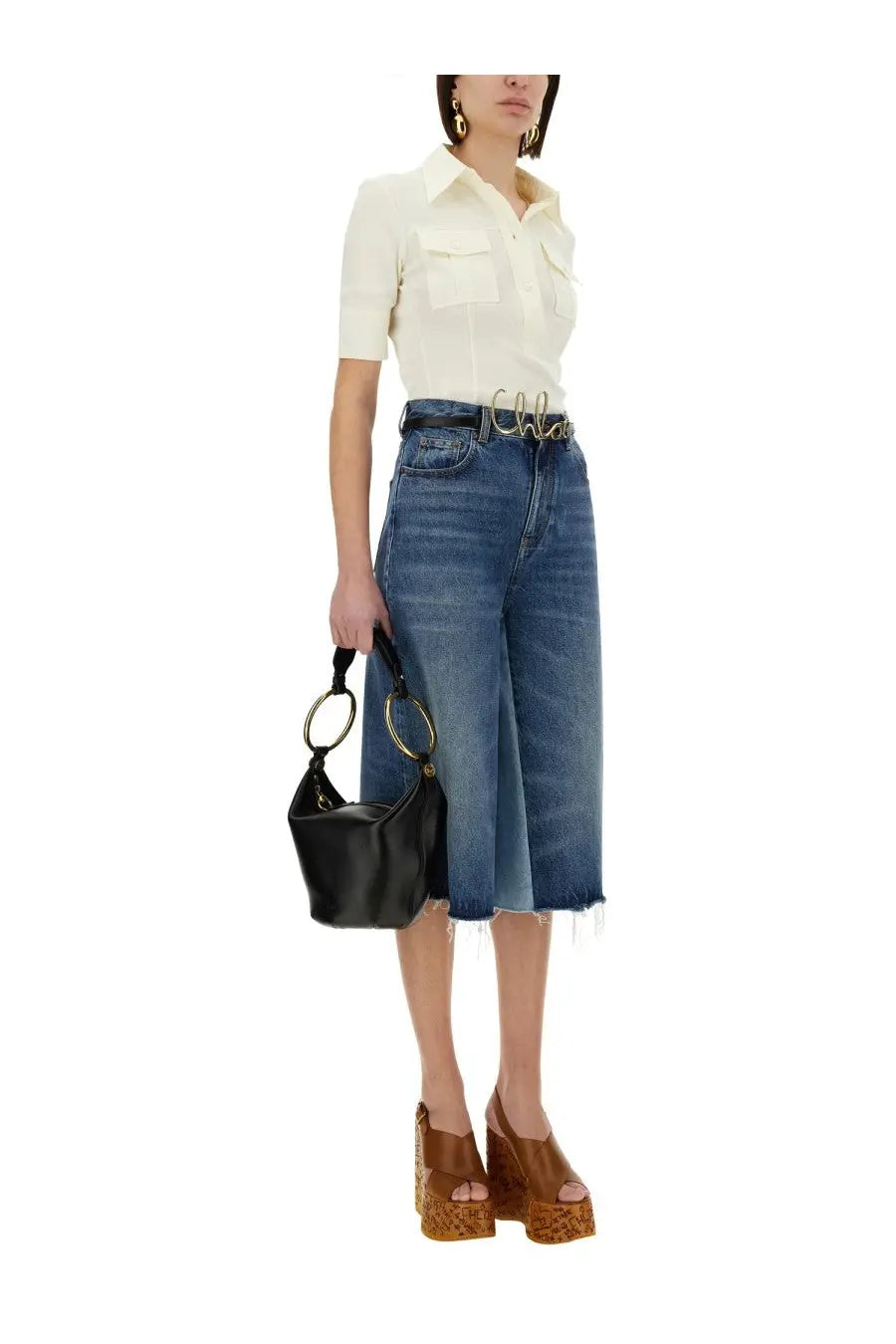 Black leather hobo bag with gold-tone circular handles complementing Chloé women’s slim fit polo white shirt
