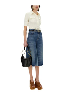 Black leather hobo bag with gold-tone circular handles complementing Chloé women’s slim fit polo white shirt