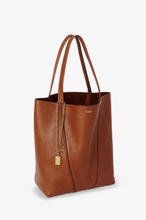 Brown leather tote bag with gold-tone chain and padlock charm by chloé for women