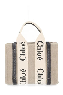 Chloé women’s beige canvas tote bag with black leather trim cream handles and bold chloé lettering