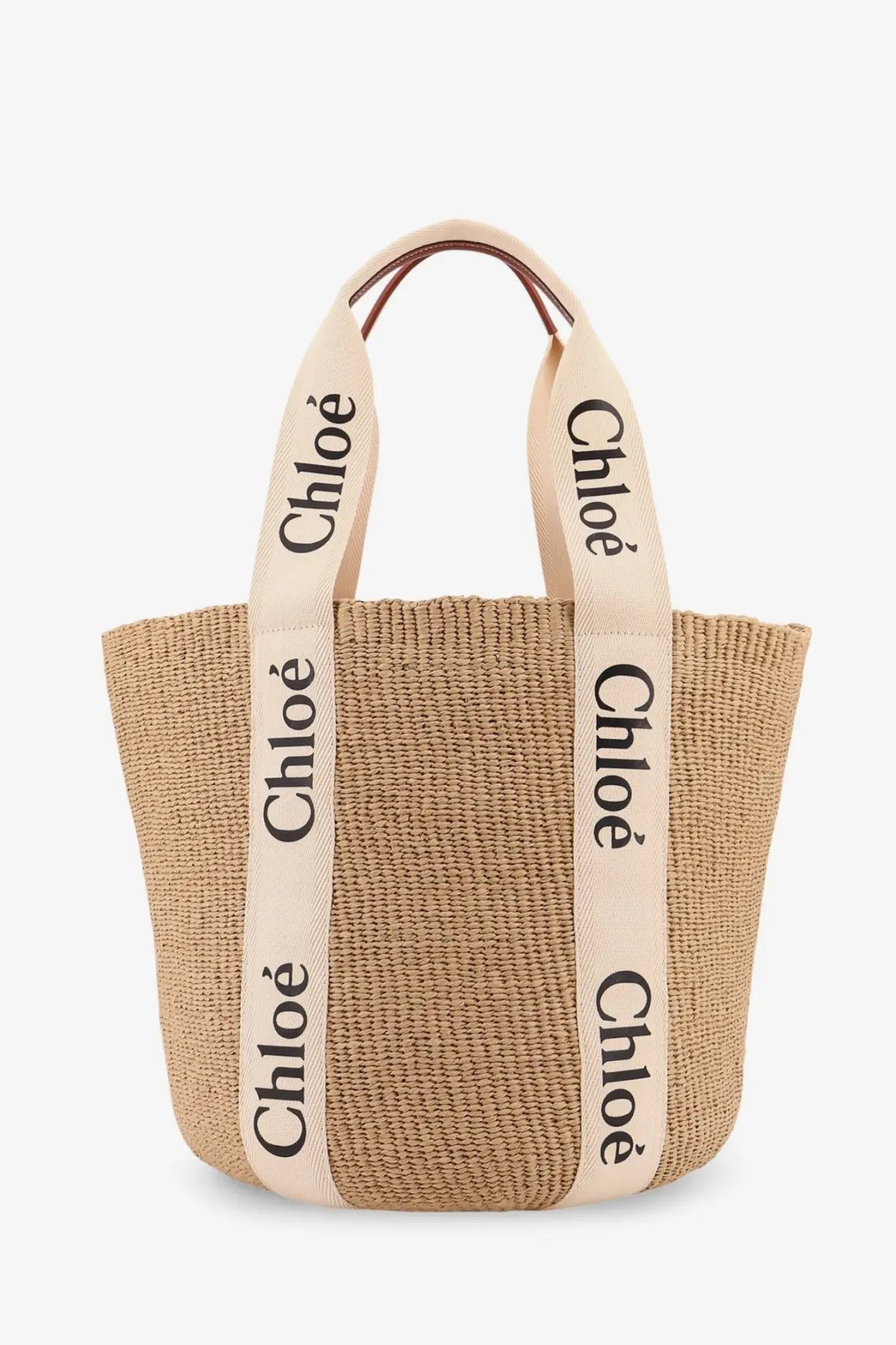 Beige woven straw tote bag with cream fabric handles and black chloé branding for women by chloé