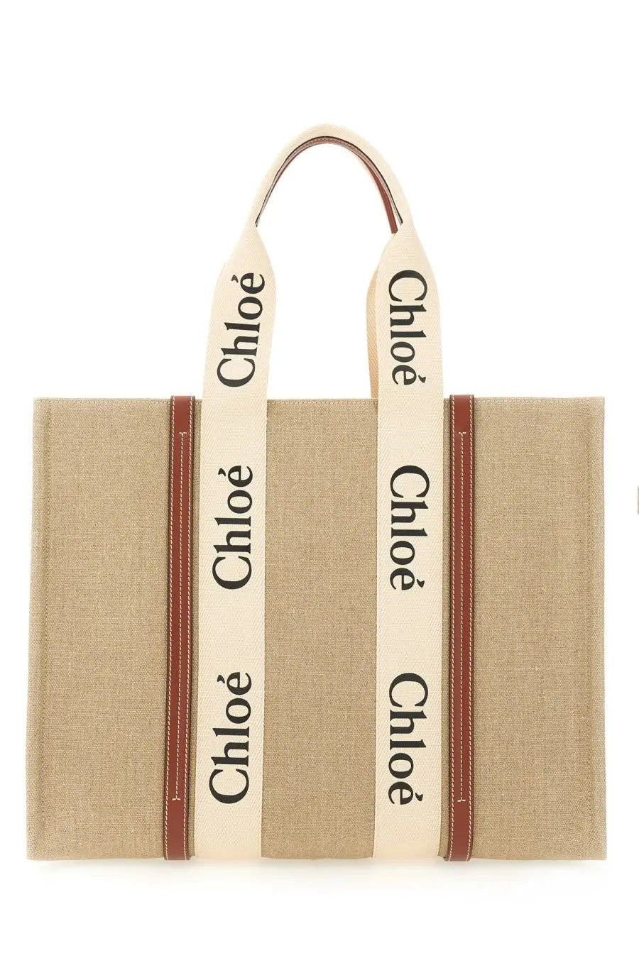 Beige canvas chloé women’s woody tote bag with cream straps black lettering and brown leather trim