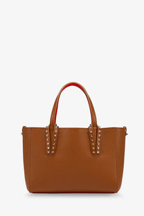 Christian Louboutin women’s beige pebbled leather tote bag with gold-tone studs and red interior lining