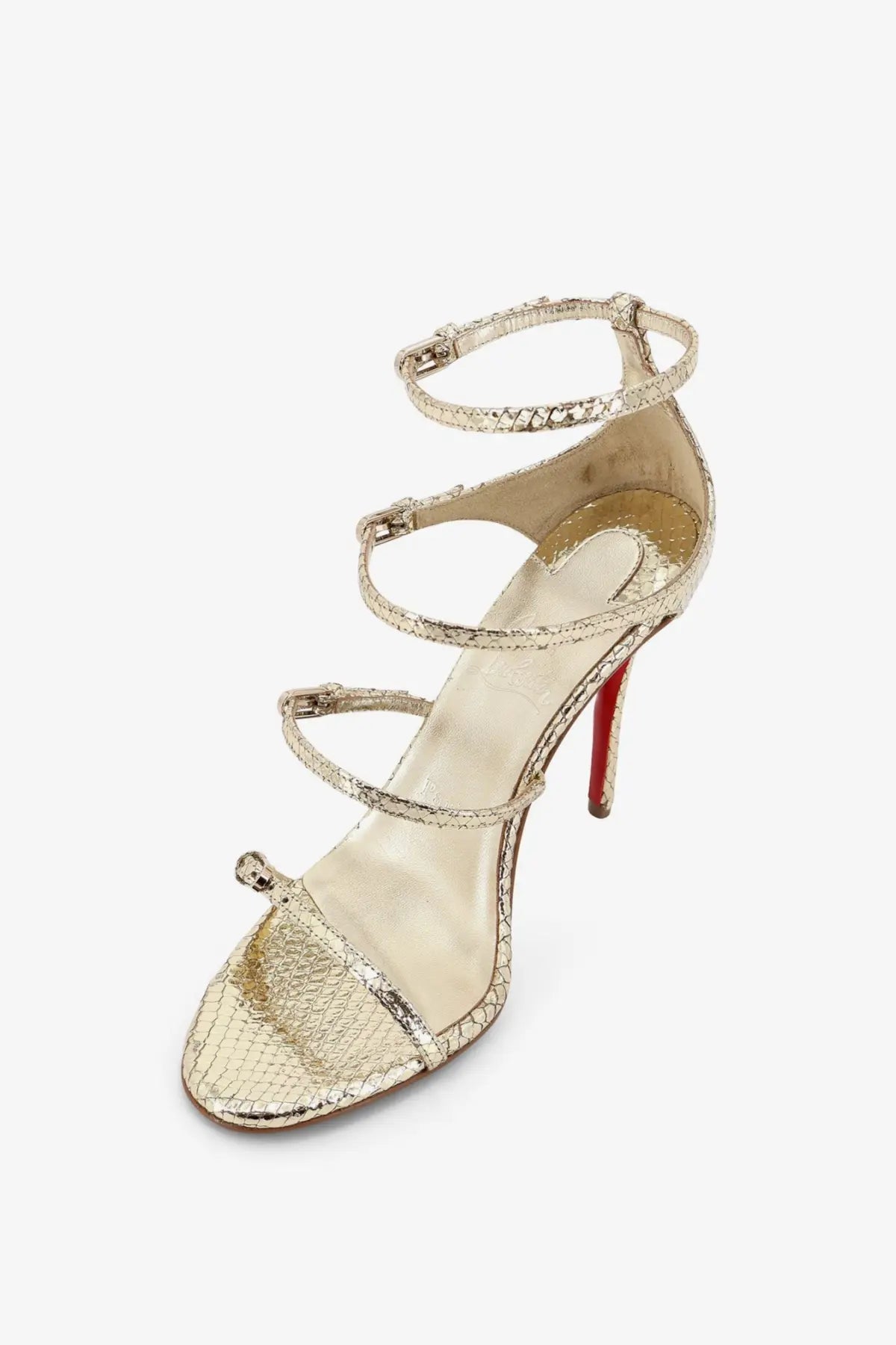 Christian Louboutin women’s millennium python leather sandal in gold with strappy design and signature red sole