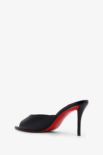 Christian Louboutin women’s Miss Mule patent leather sandals in black with signature red sole visible from the back side