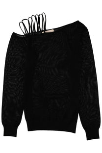 Back view of circus hotel women’s black off-the-shoulder knit sweater with lamé yarn and lace-up back detail