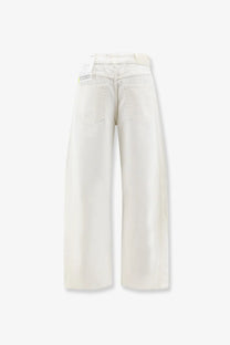 Cream-colored wide-leg cotton trousers with relaxed fit and classic back pockets shown from the back side