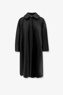 Black wool coat with classic collar and straight-cut silhouette from comme des garcons play womens collection