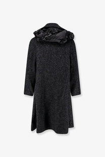 Black textured wool coat with a ruffled hood from Comme Des Garcons Play women’s white collection