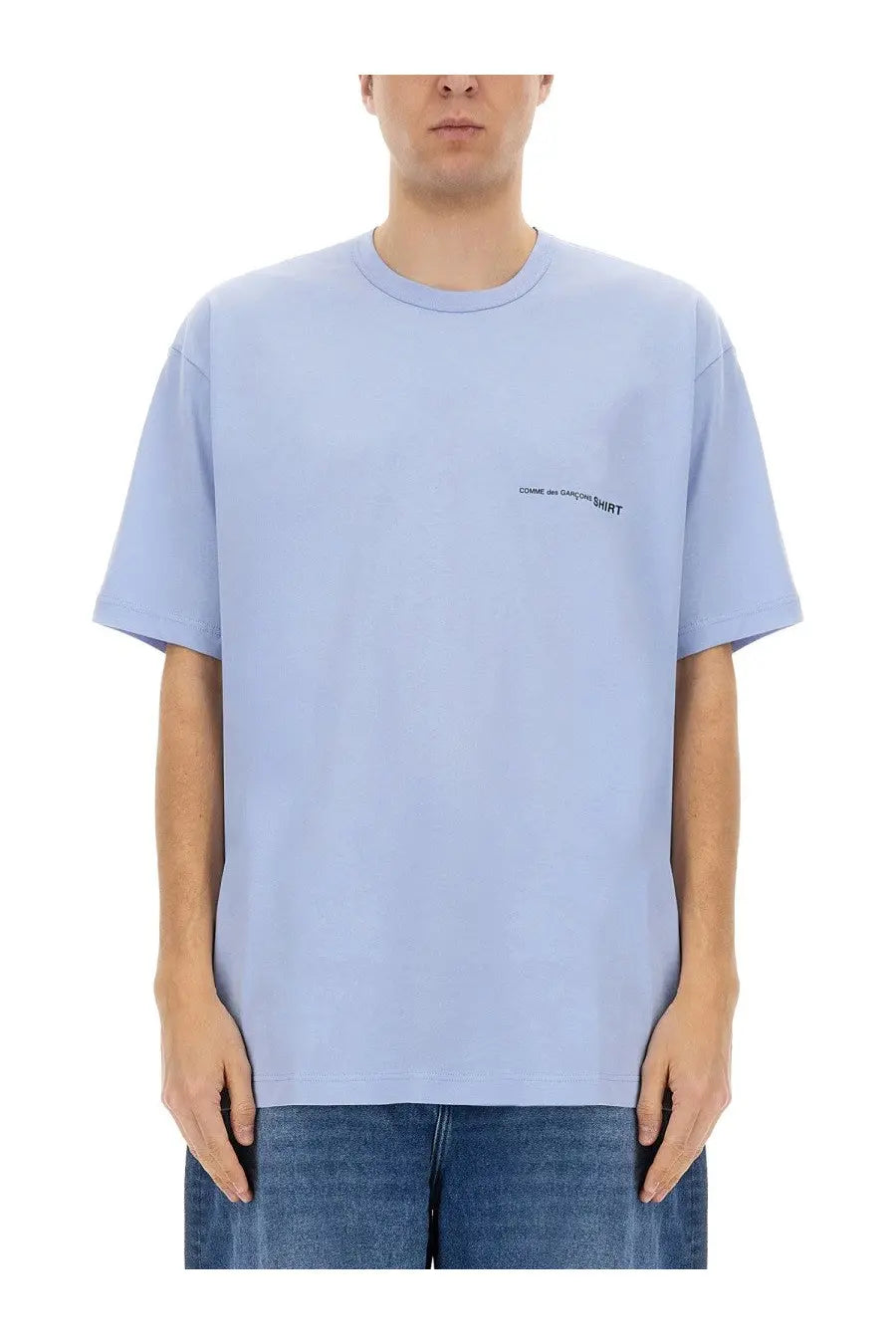 Light blue Comme Des Garcons men’s shirt with subtle black logo on left chest in cotton blend fabric