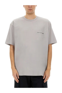 Comme des garcons shirt men’s grey oversized t-shirt with small black embroidered logo on left chest